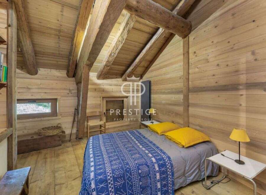 Discover the charm of this cozy cabin retreat, featuring stunning wooden interiors and a rustic ambiance.