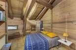Discover the charm of this cozy cabin retreat, featuring stunning wooden interiors and a rustic ambiance.