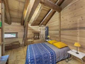 Discover the charm of this cozy cabin retreat, featuring stunning wooden interiors and a rustic ambiance.