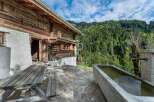 Discover the charm of this rustic wooden cabin nestled in a serene mountain setting.
