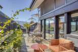 Modern deck with stylish furniture and serene mountain views.