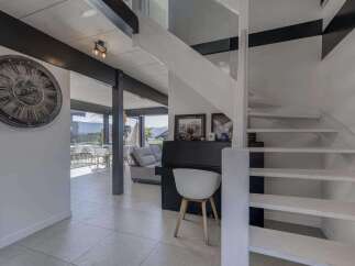 Stunning modern home boasts an open-concept floor plan with sleek, contemporary finishes.