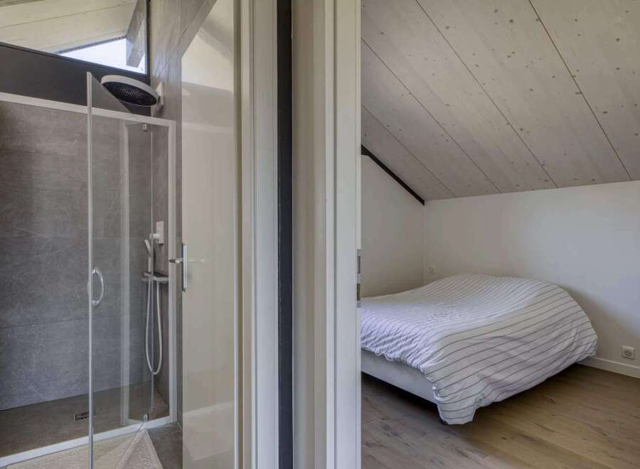 This stunning property boasts a modern ensuite bathroom with a spacious shower, perfect for relaxing after a long day.