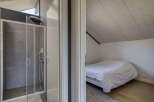 This stunning property boasts a modern ensuite bathroom with a spacious shower, perfect for relaxing after a long day.