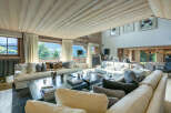 Luxurious chalet with stunning mountain views and spacious living area.