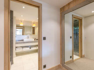 This stunning bathroom boasts a modern design with a sleek white sink and plenty of storage.