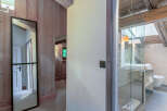 This stunning property boasts a luxurious bathroom with a glass-enclosed shower and modern fixtures.