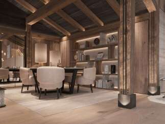 This stunning chalet boasts a spacious dining area with a large wooden table and comfortable seating, perfect for enjoying meals with family and friends.
