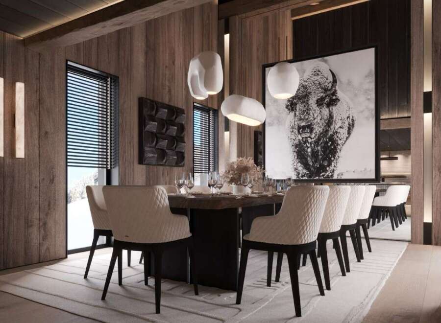 This stunning dining room boasts a large wooden table surrounded by plush, quilted chairs, creating an atmosphere of both luxury and comfort.