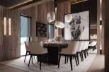 This stunning dining room boasts a large wooden table surrounded by plush, quilted chairs, creating an atmosphere of both luxury and comfort.