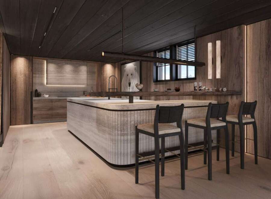 This stunning kitchen boasts a modern design with a rustic touch, featuring a large island with bar seating and sleek cabinetry.