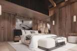 Luxurious mountain retreat with stunning wood-paneled walls and a cozy, comfortable bedroom.