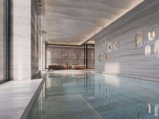 Indulge in luxury with this stunning indoor pool, featuring sleek design and serene ambiance.