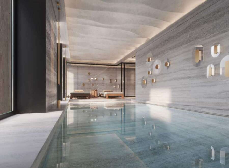 Indulge in the serene ambiance of this luxurious indoor pool, seamlessly blending natural light and sophisticated design.
