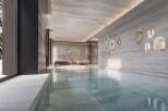 Indulge in the serene ambiance of this luxurious indoor pool, seamlessly blending natural light and sophisticated design.