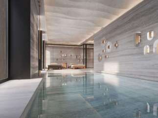 Indulge in the serene ambiance of this luxurious indoor pool, seamlessly blending natural light and sophisticated design.