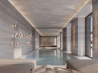 Indulge in the serene atmosphere of this luxurious indoor pool, perfect for relaxation and rejuvenation.