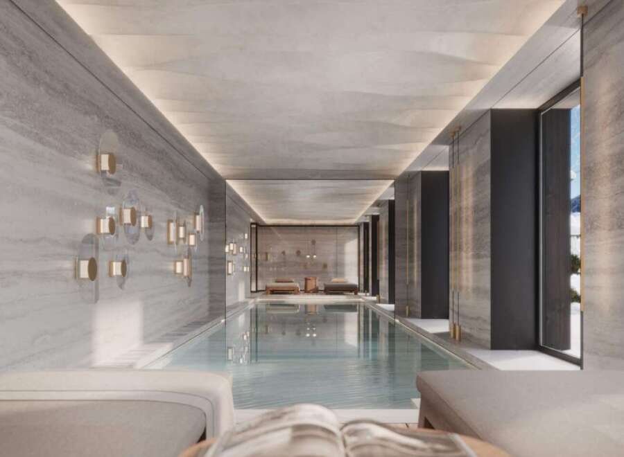 Indulge in the ultimate luxury with this stunning indoor pool, featuring sleek design and serene ambiance.