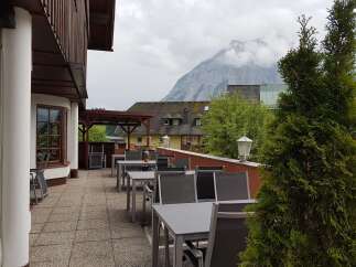 Enjoy breathtaking mountain views from the outdoor terrace of this charming property.