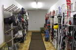 This ski storage room offers a convenient and organized space for storing your equipment.