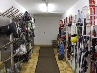 This ski storage room offers a convenient and organized space for storing your equipment.