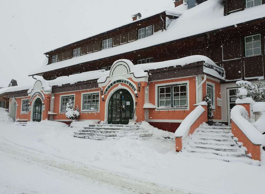 Experience a cozy stay at this charming hotel, perfect for a winter getaway.