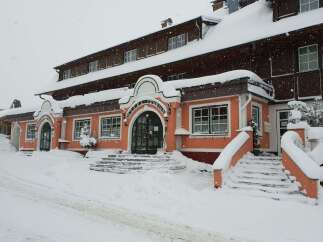 Experience a cozy stay at this charming hotel, perfect for a winter getaway.