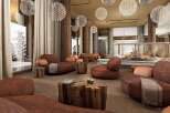 Experience ultimate relaxation in this luxurious lounge, featuring plush seating and a cozy fireplace.