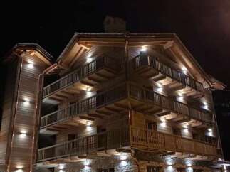 Experience luxurious alpine living at our stunning chalet, featuring multiple levels of private balconies with breathtaking night views.