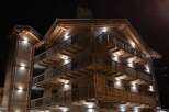 Experience luxurious alpine living at our stunning chalet, featuring multiple levels of private balconies with breathtaking night views.