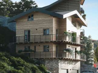 This stunning mountain home boasts a unique architectural design, blending modern and rustic elements.