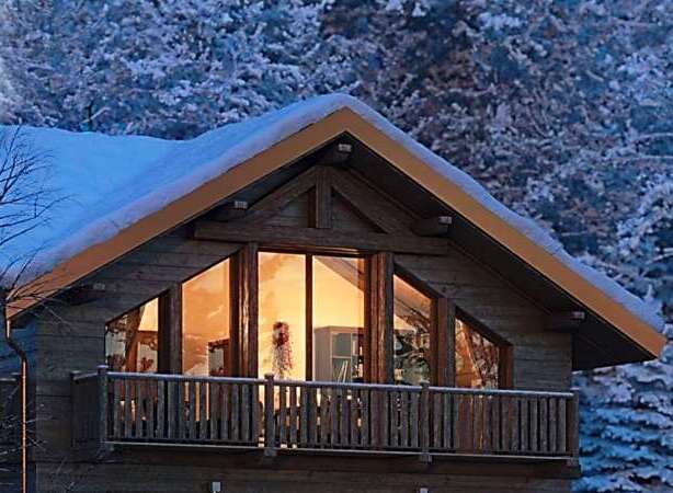 Cozy up in this stunning chalet, nestled amidst a snow-covered winter wonderland.