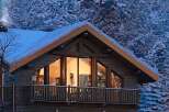 Cozy up in this stunning chalet, nestled amidst a snow-covered winter wonderland.