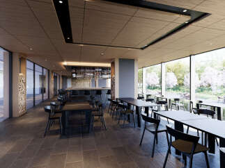 This modern restaurant boasts a sleek design with floor-to-ceiling windows offering scenic views, complemented by dark wood ceilings and black furniture.