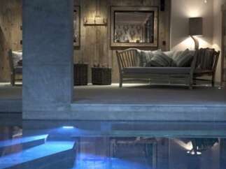 Indulge in luxury with this stunning property featuring a private indoor pool, perfect for relaxation and rejuvenation.