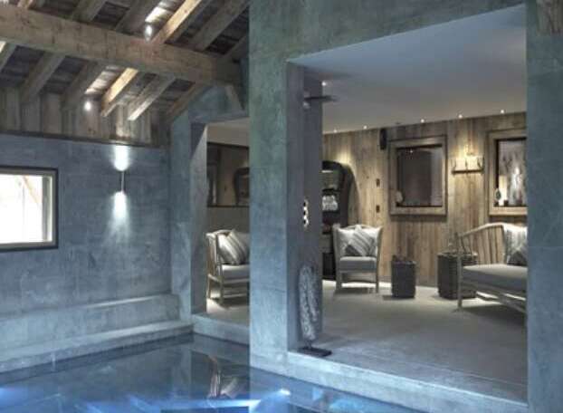 Indulge in luxury with this stunning indoor pool, nestled within a unique chalet-style property.