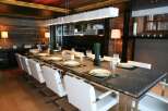 This stunning dining room boasts a sleek, modern design with a rustic touch.