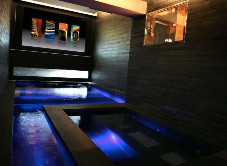 Indulge in ultimate relaxation in this luxurious home featuring a stunning indoor pool and spa.
