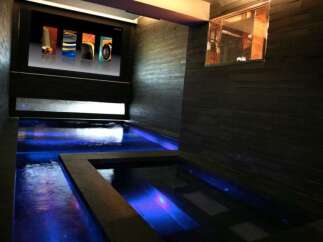Indulge in ultimate relaxation in this luxurious home featuring a stunning indoor pool and spa.