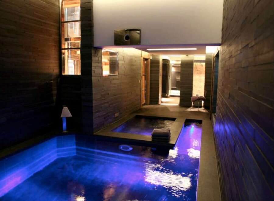Indulge in the ultimate relaxation experience with this stunning indoor pool and spa.