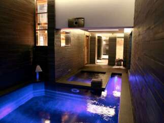 Indulge in the ultimate relaxation experience with this stunning indoor pool and spa.