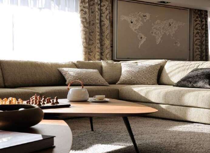 Luxurious living room with a large sectional sofa, perfect for relaxing and entertaining.