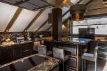 This luxurious kitchen boasts a stunning marble island with built-in seating, perfect for entertaining.