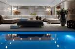 Indulge in luxury with this stunning property featuring an indoor pool and a spacious, elegantly designed living area.