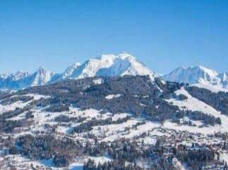 Nestled in the heart of the French Alps, this stunning property offers breathtaking panoramic views of snow-capped mountains.