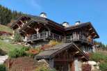 This stunning chalet boasts exquisite craftsmanship, with exposed wooden beams and stonework creating a warm and inviting atmosphere.