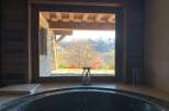 Indulge in ultimate relaxation in this luxurious hot tub, boasting breathtaking panoramic mountain views.