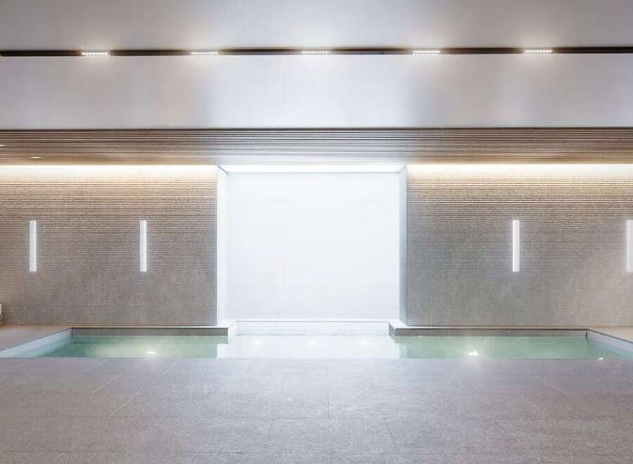 Indulge in the serene ambiance of this luxurious indoor pool, perfect for relaxation and rejuvenation.