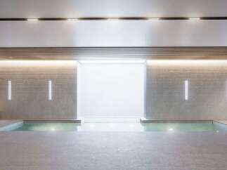 Indulge in the serene ambiance of this luxurious indoor pool, perfect for relaxation and rejuvenation.