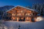 Luxury chalet in the French Alps, boasting stunning mountain views and exquisite wooden architecture.